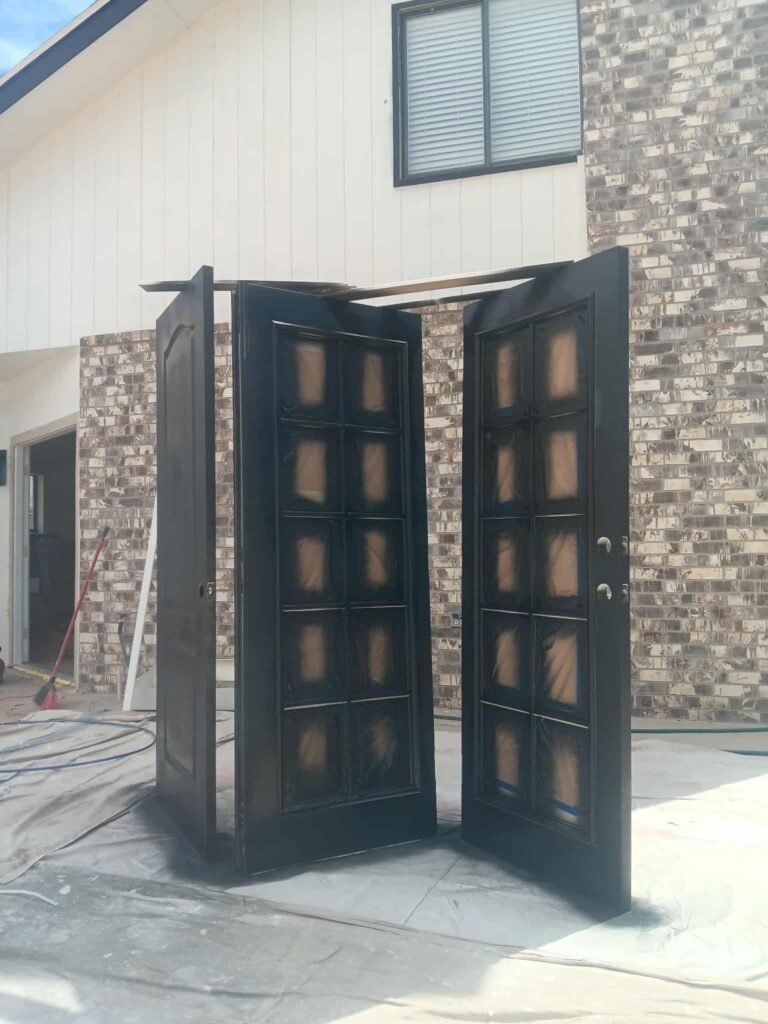 Refinished double entry doors with stone surround