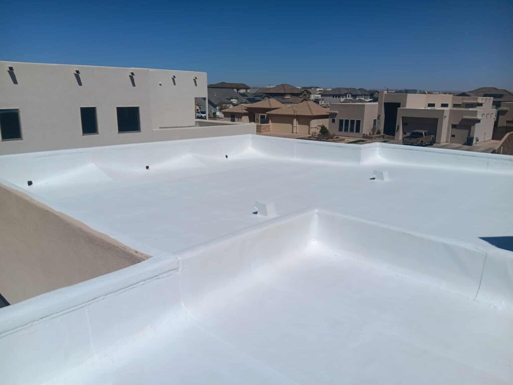 White reflective roof coating applied to a flat roof